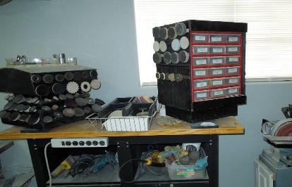 Sanding station. All abrasives and tools in one spot. Supply racks on lazy susans. 